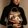 Romantic pink heart-shaped cowhide leather purse with white stone embellishments and vintage kiss-lock closure