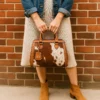 Elen Cowhide Bag 1 Brown quilted cowhide Elen bag interior view showing spacious compartments, gold zipper, and organizational pockets