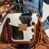 Zebra Fringe Cowhide Belted Bag 1 Distinctive cowhide leather handbag CHB-F-1021 with bold spotted pattern, eye-catching women's designer bag with unique markings