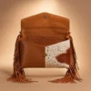 Fringe Boho Cowhide Cross body Leather Tassel Purse 3 Bohemian brown cowhide leather crossbody purse with decorative tassel fringe and secure closure for everyday casual style